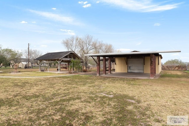 exterior space with a garage and an outdoor structure