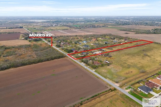 birds eye view of property featuring a rural view