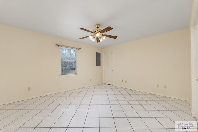 spare room with electric panel and ceiling fan