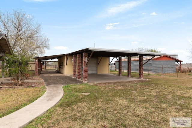 view of front of house with a front lawn and a carport