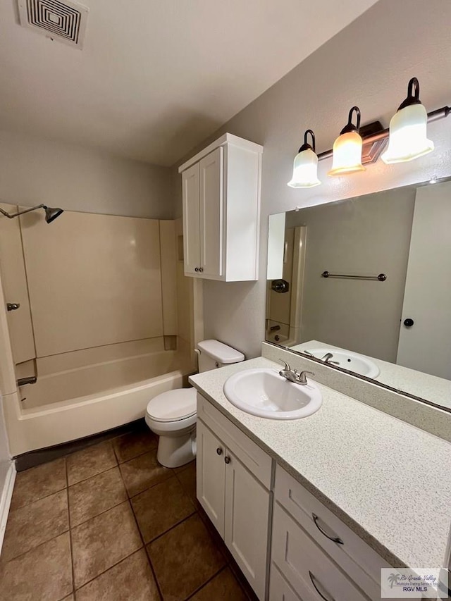 full bathroom featuring tile patterned flooring, vanity, toilet, and shower / bathtub combination