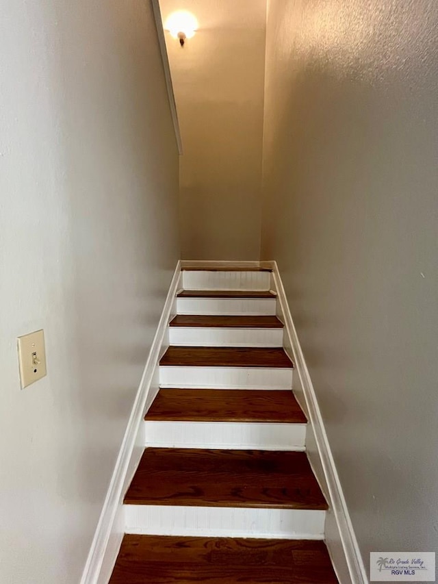 stairway with wood-type flooring