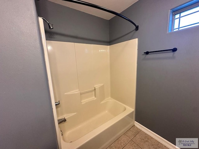 bathroom featuring tile patterned floors and bathtub / shower combination