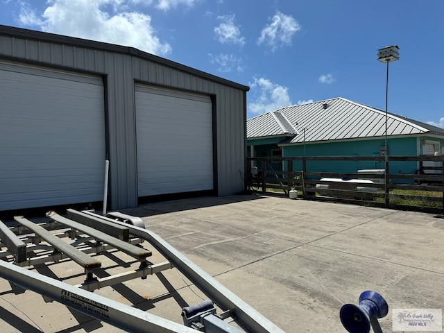 exterior space with an outbuilding and a garage