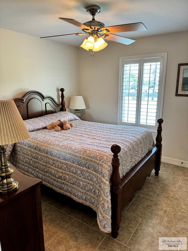 bedroom featuring tile patterned flooring and ceiling fan