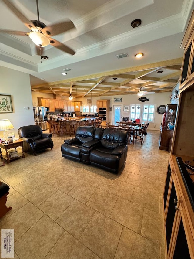 living room with beam ceiling, coffered ceiling, a tray ceiling, light tile patterned floors, and ornamental molding