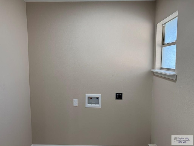 clothes washing area featuring hookup for an electric dryer and washer hookup