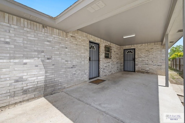 9315 Los Olmos Dr, Los Fresnos, TX 78566 - view of patio with an attached carport