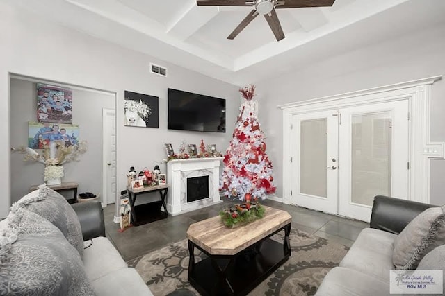 living room featuring french doors and ceiling fan