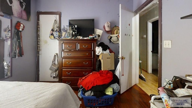 bedroom featuring dark wood-style floors