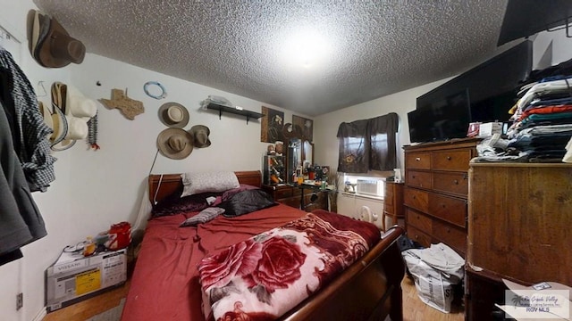 bedroom featuring a textured ceiling