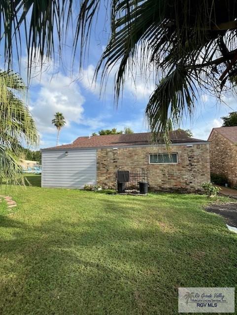 220 Country Club Rd Unit 2, Brownsville, TX 78520 - exterior space featuring a lawn