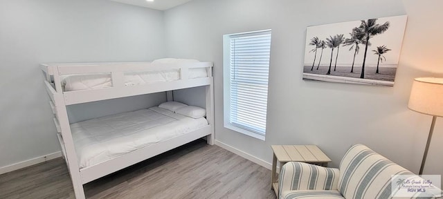 bedroom with hardwood / wood-style flooring