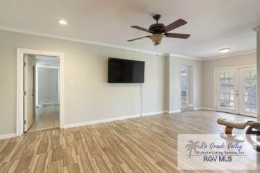 unfurnished living room featuring ceiling fan, light wood-type flooring, crown molding, and french doors