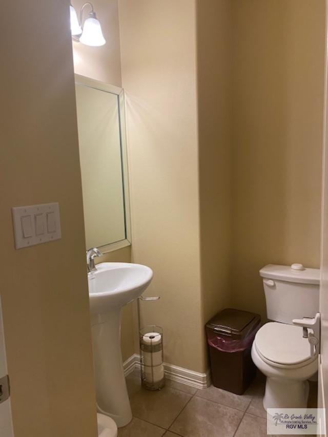 bathroom featuring tile patterned flooring and toilet