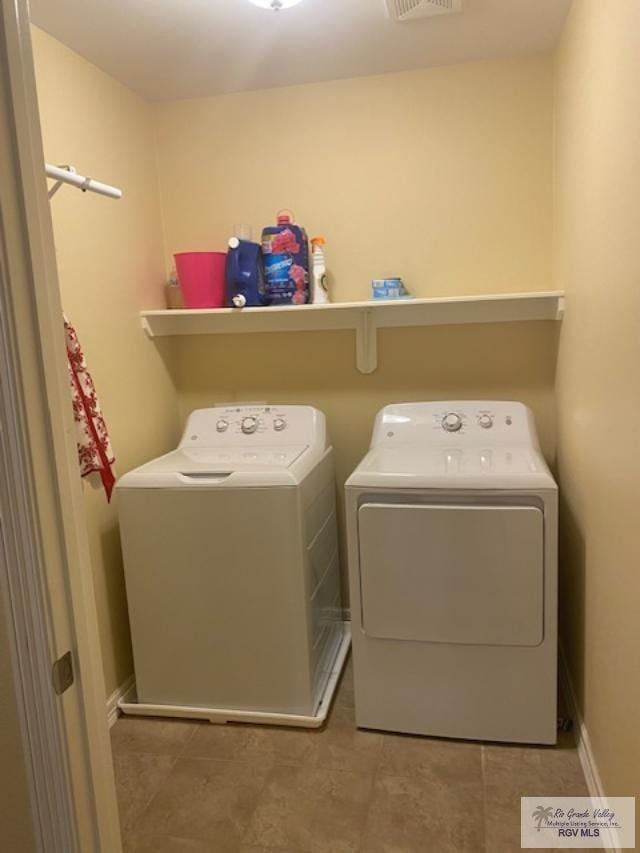 washroom with separate washer and dryer