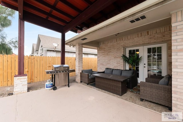 view of patio featuring visible vents, fence, french doors, outdoor lounge area, and a grill