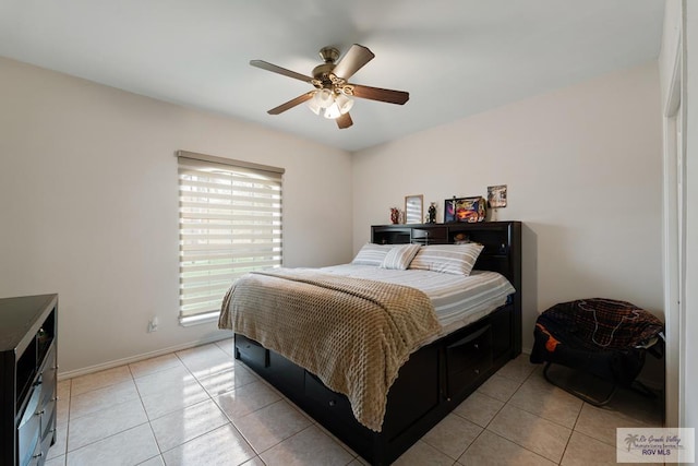 bedroom with light tile patterned floors, baseboards, and ceiling fan