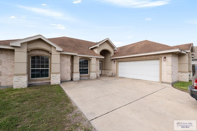 ranch-style home with concrete driveway, an attached garage, brick siding, and roof with shingles