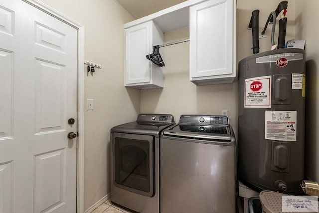 washroom with separate washer and dryer, cabinet space, electric water heater, and light tile patterned floors