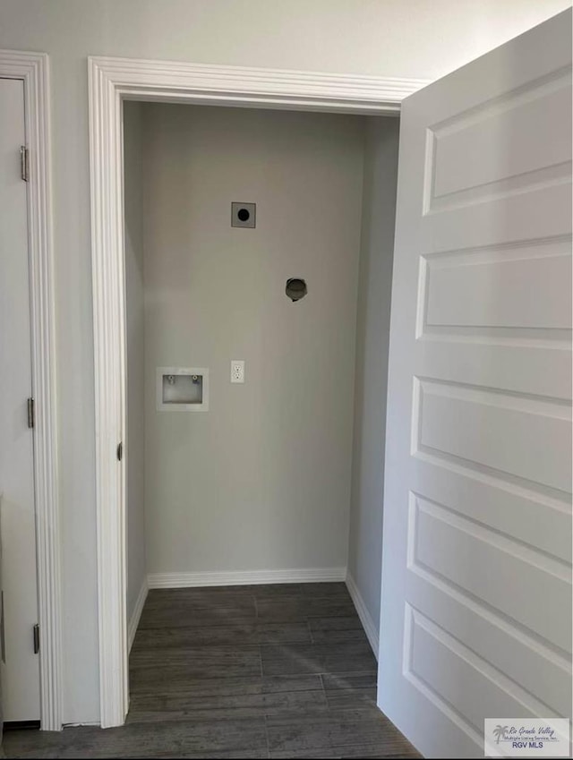 laundry room with dark wood-type flooring, hookup for a washing machine, and electric dryer hookup