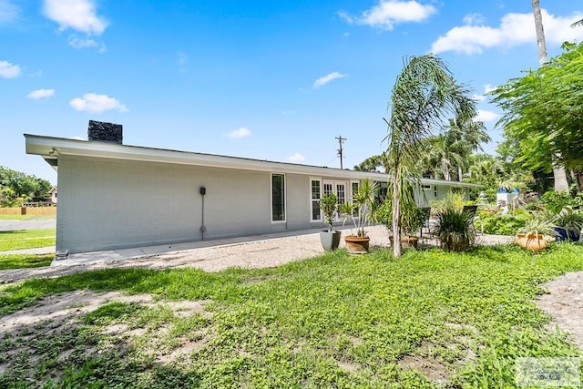 rear view of house featuring a patio area