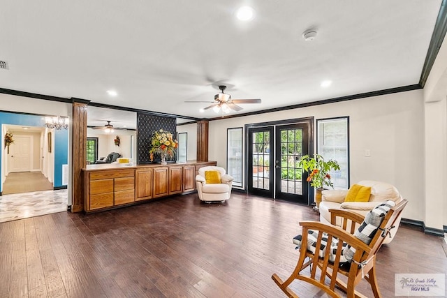 living area featuring ornamental molding, a ceiling fan, dark wood finished floors, french doors, and baseboards