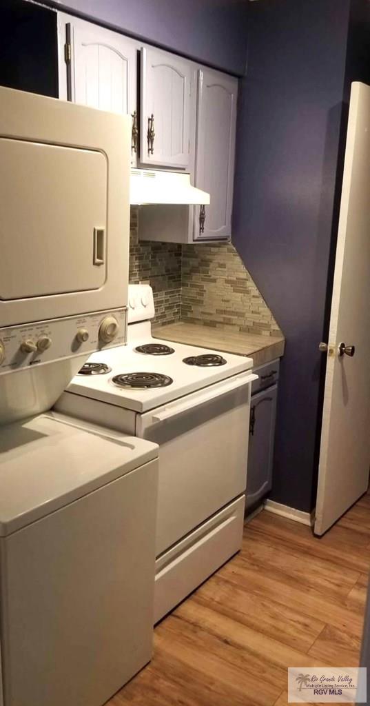 kitchen featuring light hardwood / wood-style floors, decorative backsplash, and white cabinets