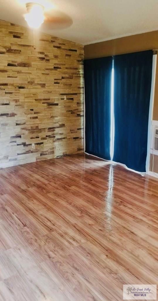 unfurnished room with light wood-type flooring