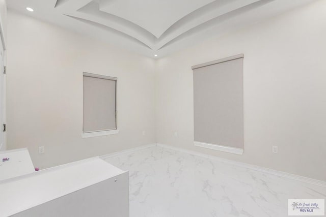 unfurnished room with marble finish floor, recessed lighting, and baseboards