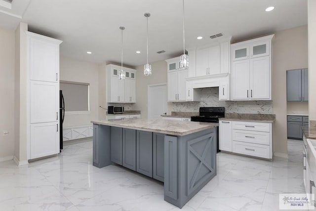 kitchen with black appliances, marble finish floor, tasteful backsplash, and white cabinets