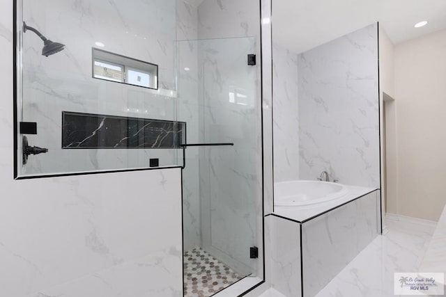 full bath featuring marble finish floor, a marble finish shower, a bath, and recessed lighting