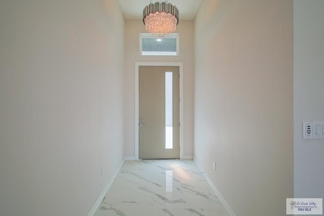 doorway featuring an inviting chandelier