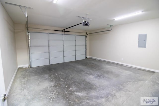 garage featuring electric panel and a garage door opener