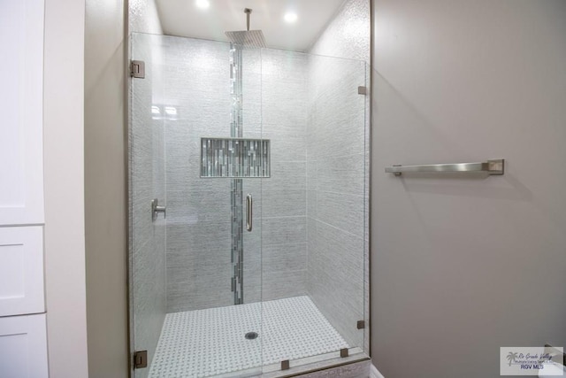 bathroom featuring an enclosed shower