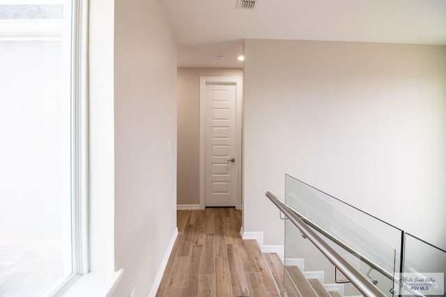 hall with light hardwood / wood-style flooring