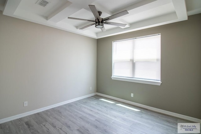 spare room featuring light hardwood / wood-style flooring and ceiling fan