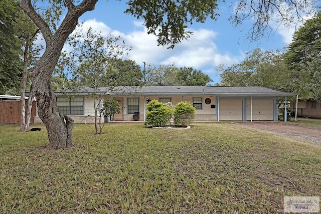 single story home with a garage and a front lawn