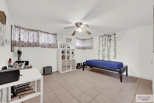 tiled bedroom with ceiling fan