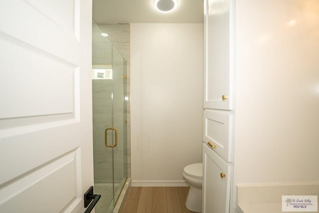 2409 Brown Pelican Ln, Harlingen, TX 78552 - bathroom featuring a stall shower and wood finished floors