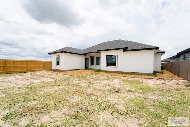 2409 Brown Pelican Ln, Harlingen, TX 78552 - back of house with a fenced backyard and roof with shingles