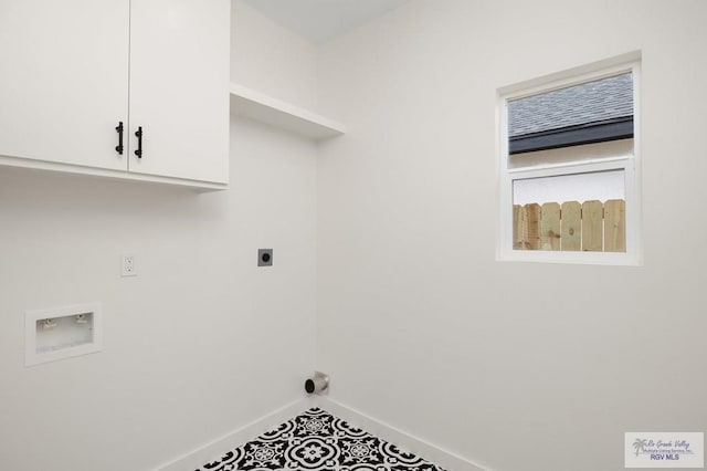 washroom with cabinet space, electric dryer hookup, baseboards, and washer hookup