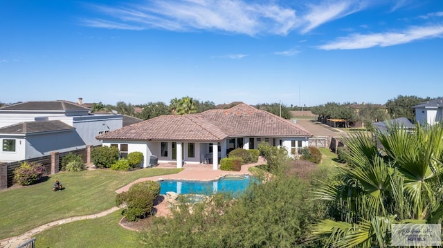 4329 Waters Edge, Harlingen, TX 78550 - back of house featuring a fenced in pool and a yard