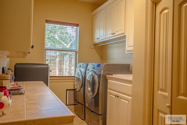 4329 Waters Edge, Harlingen, TX 78550 - laundry area featuring separate washer and dryer and cabinets