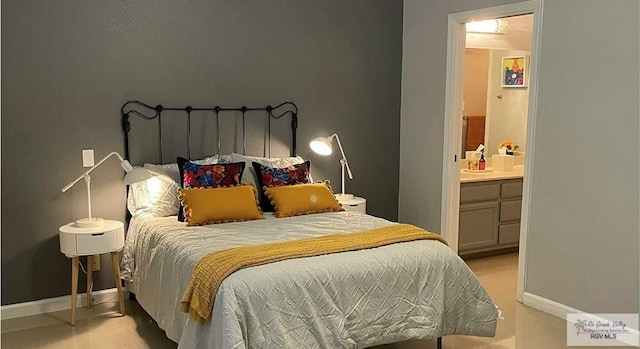 6251 Camelot Dr, Harlingen, TX 78550 - bedroom with baseboards and connected bathroom