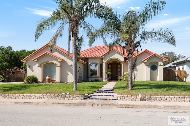 5512 Autumn Mist Ln, Brownsville, TX 78521 - mediterranean / spanish house featuring a tile roof and stucco siding