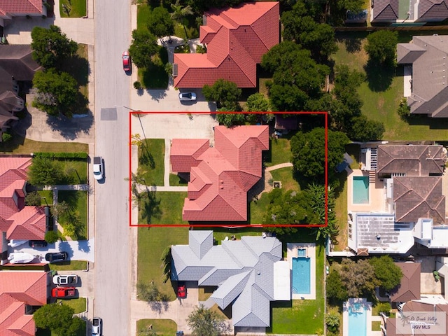 5512 Autumn Mist Ln, Brownsville, TX 78521 - aerial view of residential area with a pool area and property boundaries highlighted