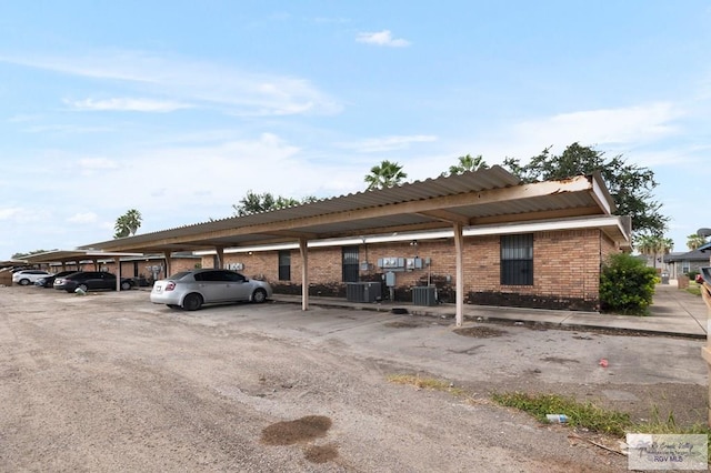 view of vehicle parking with a carport