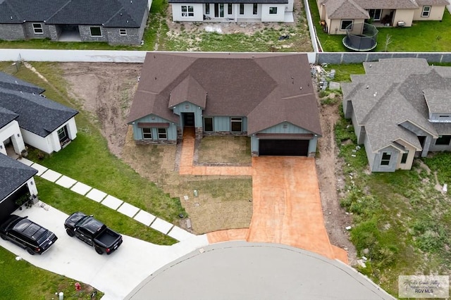 birds eye view of property with a residential view