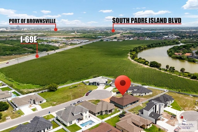 bird's eye view featuring a residential view and a water view